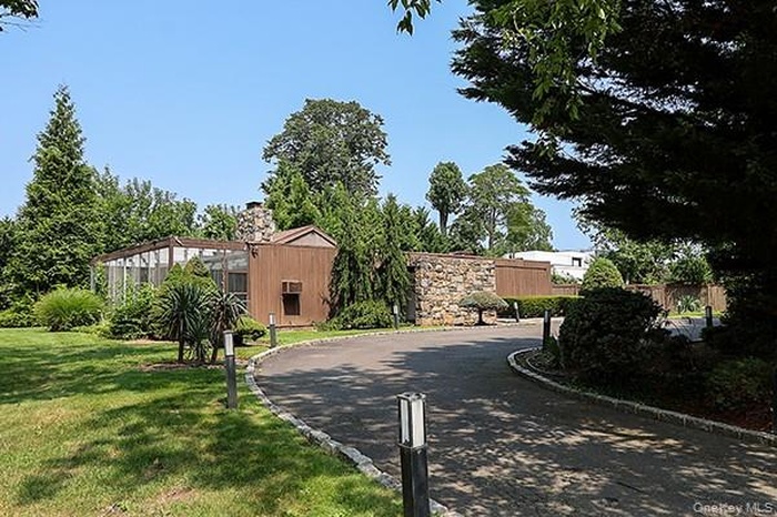 View of asphalt road featuring curbs