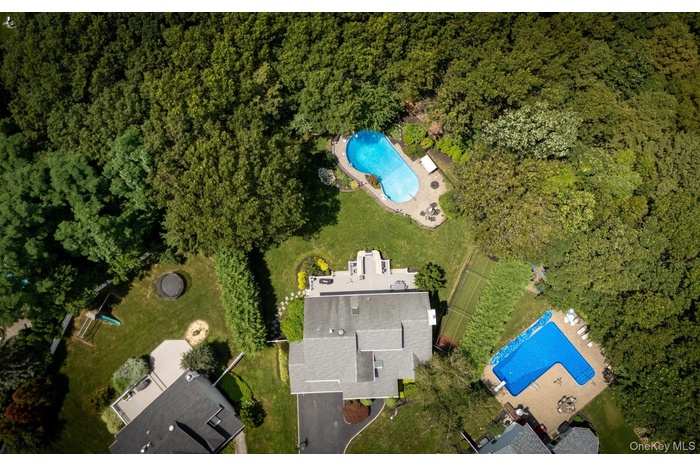 Aerial overview of property's location with a pool area