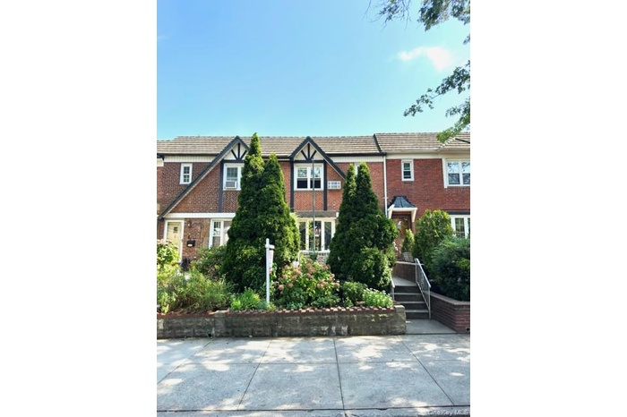 View of front of property featuring brick siding