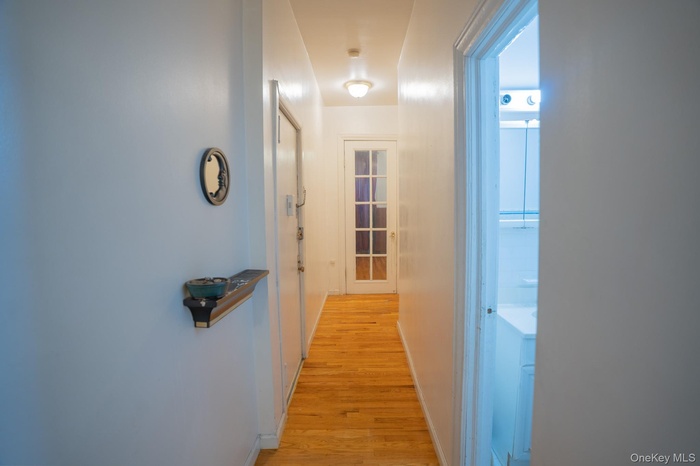 Hallway featuring light wood-type flooring