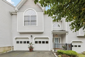 Enjoy a maintenance free lifestyle in this gracious townhome in sought after Forest Ridge.