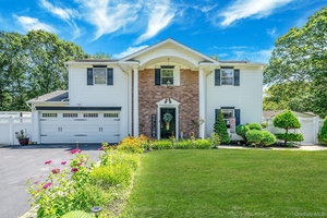 Welcome to this beautiful Colonial in the W section of Coram in Middle Country School district.