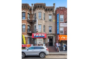 Fully occupied mixed use building located in high traffic area at the intersection of Baxter Ave, Ithaca St, and 82nd St.