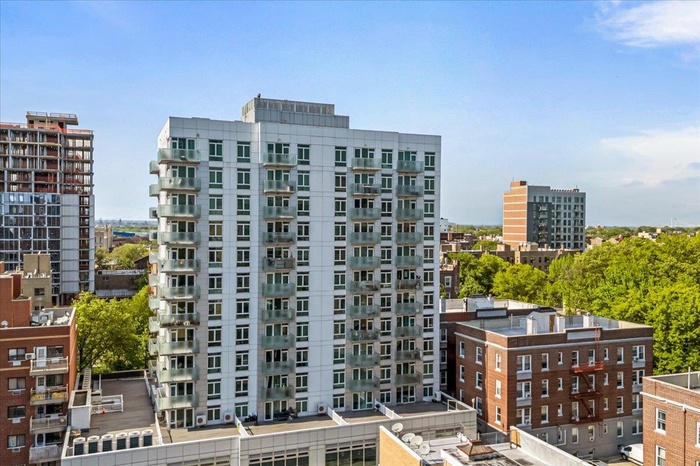 View of apartment building / complex with a city view