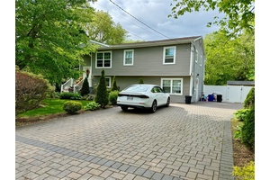 Welcome to 243 Sea Cliff Street, a spacious Hi Ranch home nestled in the heart of Islip Terrace.