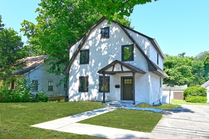 View of front of house with stucco siding