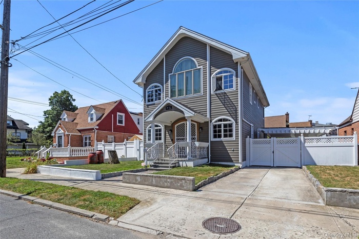 View of front of house with a gate