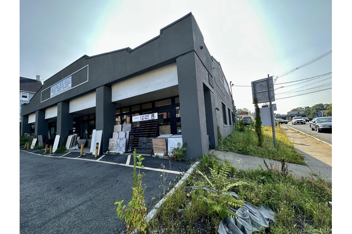View of property with uncovered parking