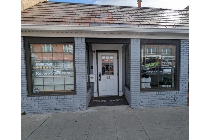 Property entrance with brick siding