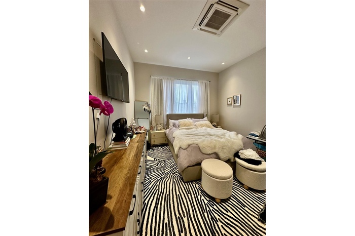 Bedroom featuring recessed lighting