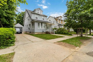 Welcome to this beautifully maintained single family home nestled in the heart of Addisleigh Park Step into the inviting enclosed front porch, perfect for morning coffee or evening relaxation.