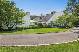 This stunning property boasts a chef s kitchen with luxurious marble countertops, and Moroccan tile floors, perfect for culinary enthusiasts.