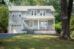 Charming and Versatile Colonial home with Duplex Zoning Currently used as a Single Family home, however can be easily converted back to two separate dwellings.