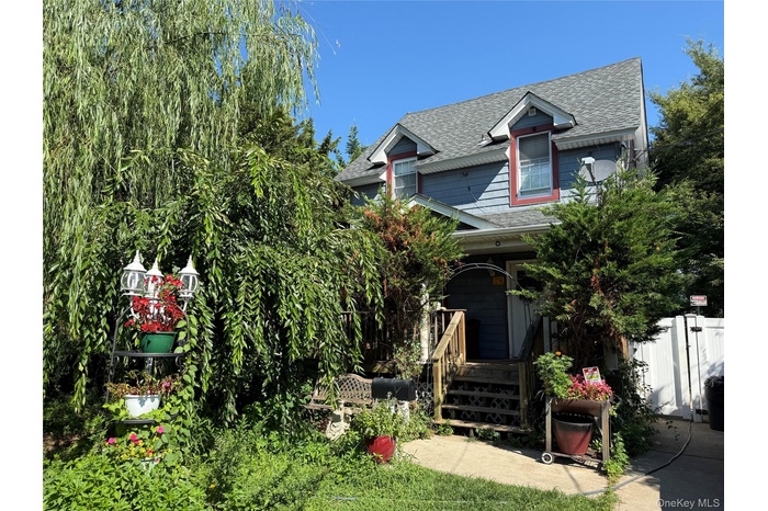 Victorian-style house featuring roof with shingles