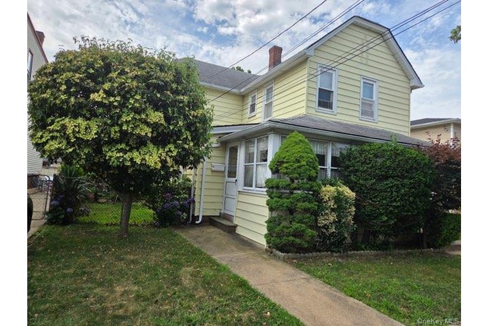 View of front of property with a chimney
