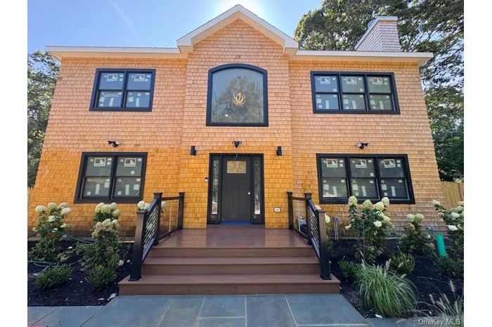 View of front of property featuring a chimney