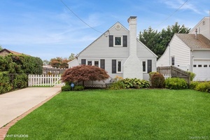 Lovely single family Cape Cod in the Frederick Shores section that boasts its own Private Beach !