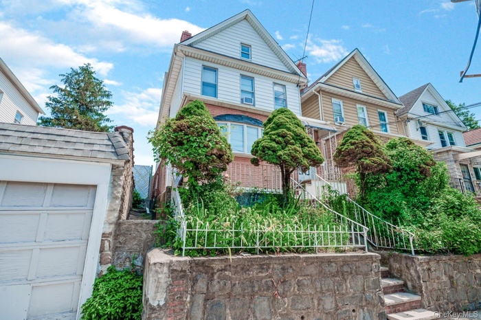 View of front of property featuring a garage