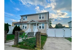 The property located at 271 Babylon Freeport, is a charming 2 family home that embodies a blend of classic architecture and modern comfort.
