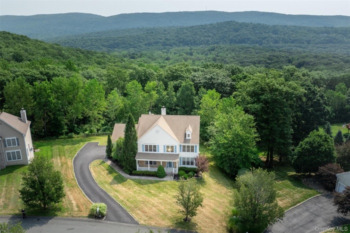 View from above of property with a mountainous background