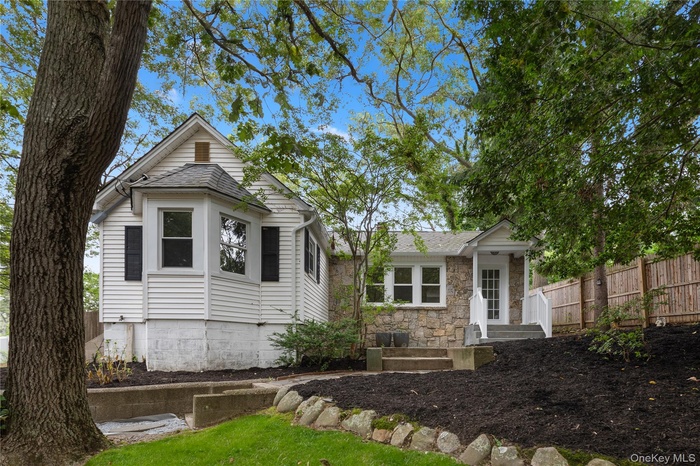 View of front of house with stone siding