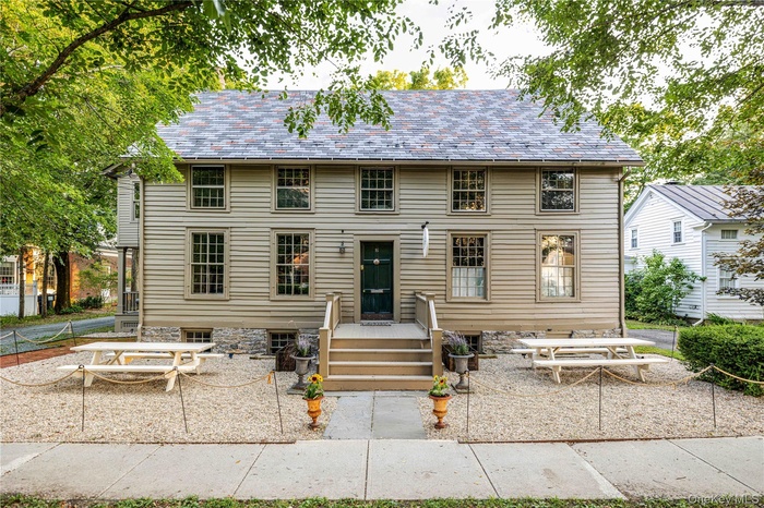 Colonial home with a high end roof