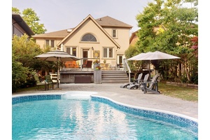 Large, welcoming, sidesplit home with gas fireplace, 3 Bedrooms plus Office, 4 bathrooms, ground floor family room, games room with bar, recreation room and finished basement.