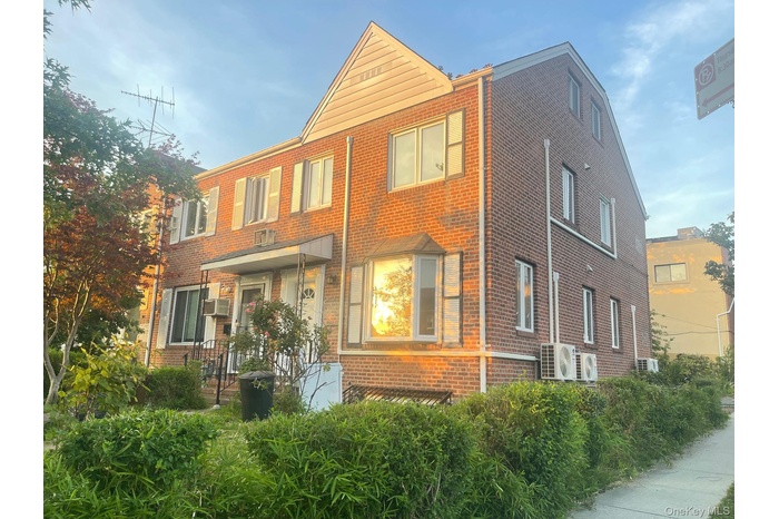 View of front of property with brick siding