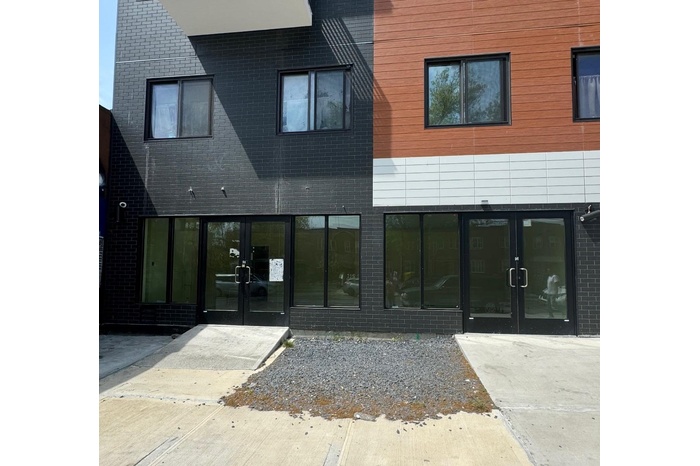 Rear view of house featuring french doors and brick siding