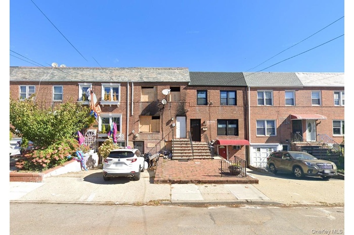 View of front facade featuring brick siding