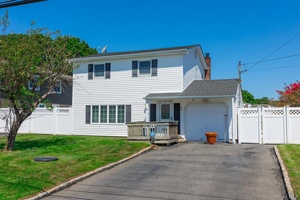 Charming Colonial style home with 4 bedrooms and 2 full baths in the heart of Patchogue.