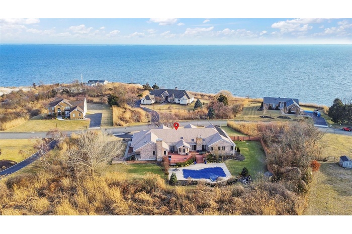 Aerial view featuring a residential view and a water view