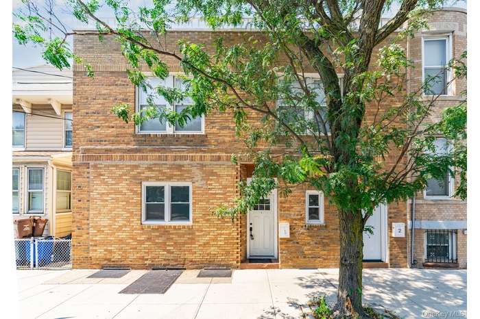 Traditional home featuring brick siding