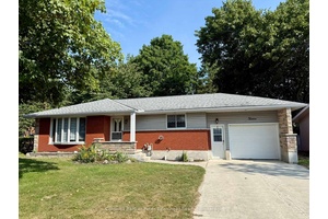 Charming bungalow with ravine yard and fully finished basement.