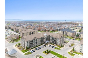 Experience penthouse living at its finest in this stunning corner unit suite at The Courtyards On Main Street, where 10 foot ceilings and expansive windows create an airy, light filled ...