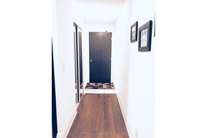 Stylish 1 bedroom condo for lease featuring a modern kitchen with stainless steel appliances and an island.
