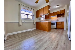 Prime Location ! Charming 2 bedroom, 1 bathroom brick bungalow main floor unit, offering bright living space in a quiet neighborhood.
