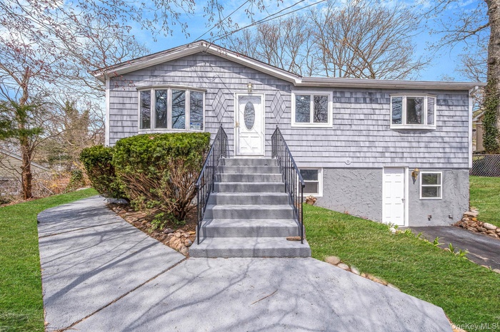 View of front of property with a front lawn