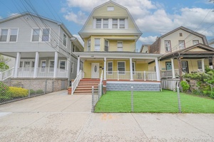 Step into timeless elegance with this grand Victorian home, legally configured as a 3 family residence and brimming with historic character.