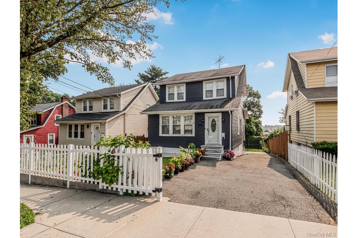 View of front of property featuring a fenced front yard