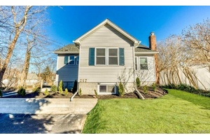 Welcome to 217 Sound Beach Boulevard, a charming Cape Cod style residence located in the serene town of Sound Beach.