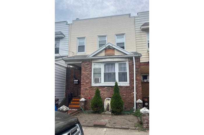View of front of house with brick siding