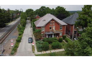 Prime Investment Opportunity Unlock the immense potential of this red brick home at 2 4 Glasgow Street South, a remarkable investment opportunity perfectly situated on a corner lot in the ...