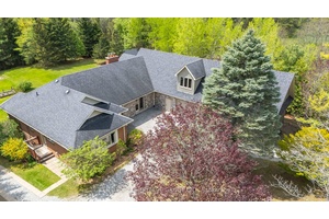 Discover the perfect blend of refined comfort and natural beauty on over 10 acres of land, featuring a private pond, mature trees, and wooded walking trails that offer unmatched privacy ...