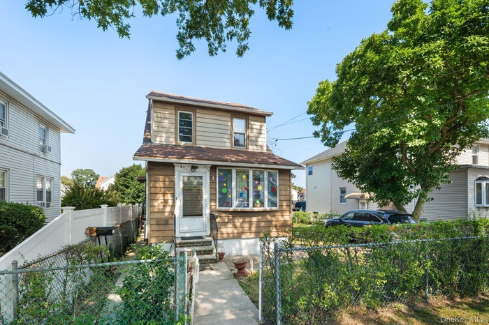 View of front of property with a fenced front yard