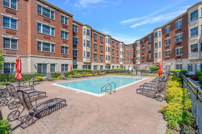 Community pool with a patio area