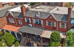 Welcome to this meticulously maintained brick attached rowhouse, single family residence nestled in the vibrant heart of Woodside, Queens.