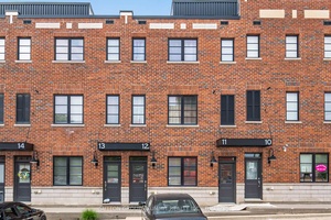 Welcome to this beautifully designed urban stacked townhouse offering over 1, 200 square feet of stylish living space.