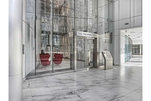 FULLY FURNISHED UNIT NEUTRAL INTERIOR 1 BEDROOM WITH A STUD AREA A JULIETTE BALCONY A DESK amp ; CHAIR AT BUSY ANDBUSTING DOWNTOWN CORE OF TORONTO 540 SQ.
