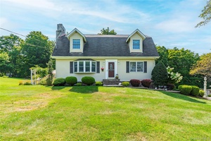 Welcome to this charming Cape Colonial style home, perfectly set on a private and impeccably maintained 1.